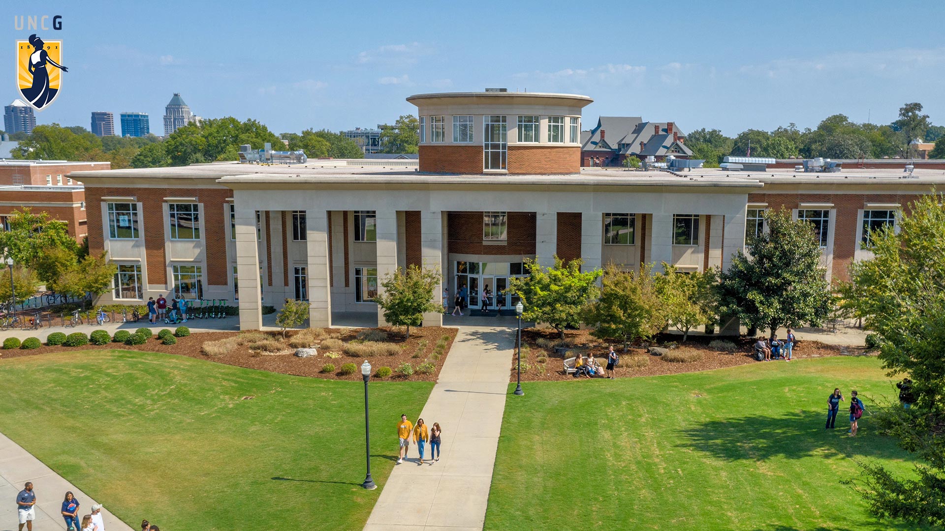 Aerial view of the Elliott University Center with the UNCG logo in top left corner